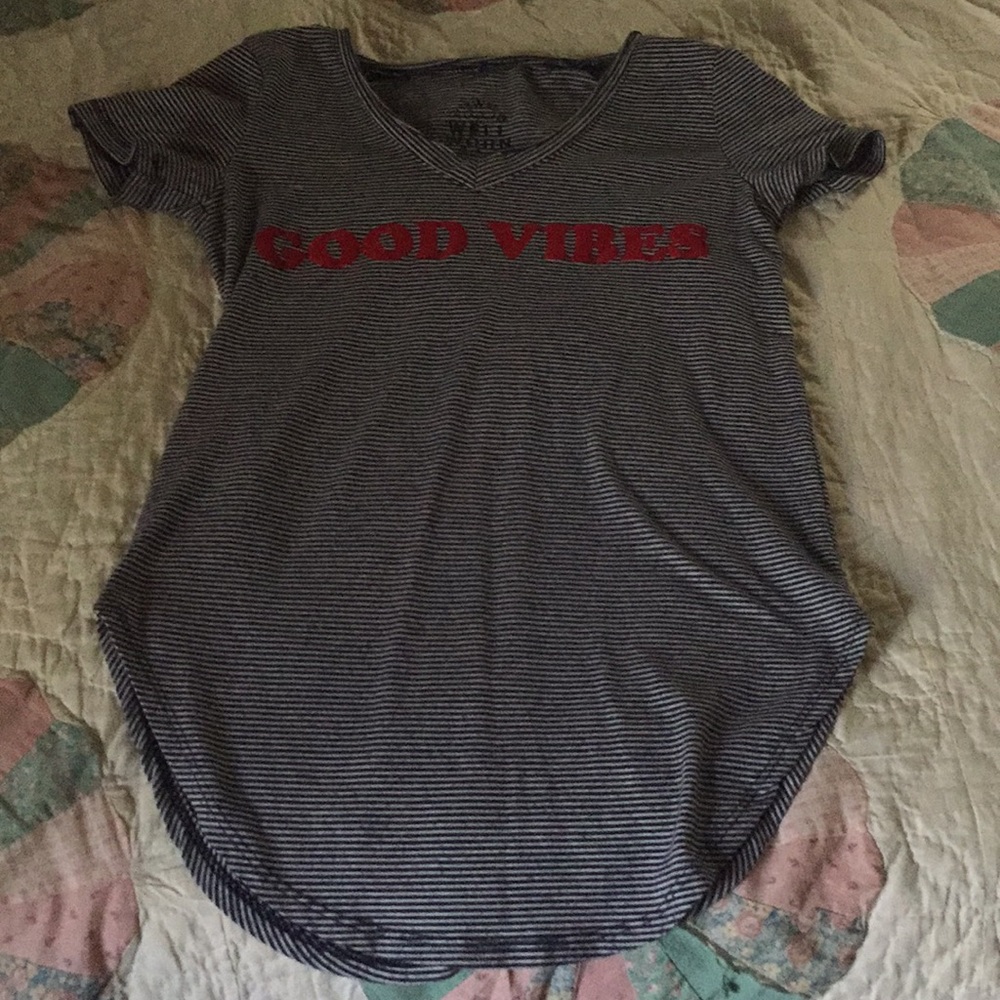 Black and white thin striped top with red letters